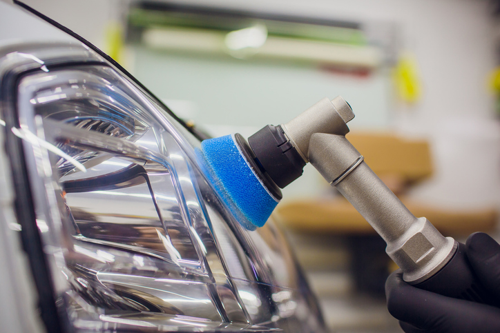 Car Zone Auto Detailing employee doing Headlight Restoration
