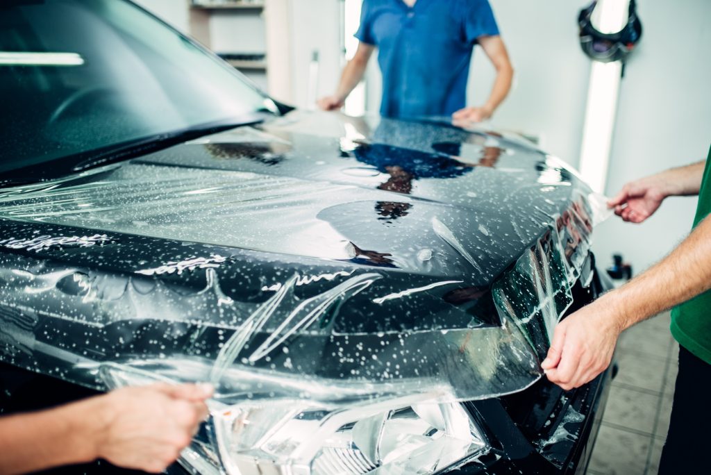 Professional installation of Paint Protection Film on a luxury vehicle in Burlington at Car Zone Auto Detailing.