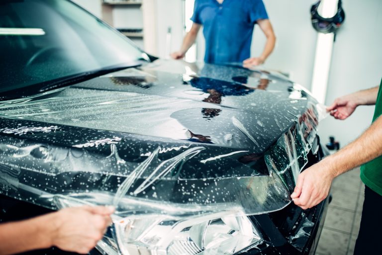 Professional installation of Paint Protection Film on a luxury vehicle in Burlington at Car Zone Auto Detailing.
