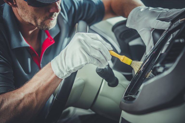 Technician performing interior car detailing in Burlington