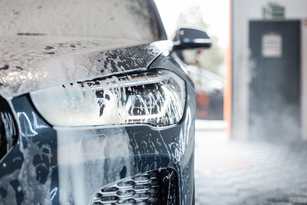 Car detailing maintenance in Burlington – clean black car with ceramic coating being washed and detailed at CarZone Auto Detailing