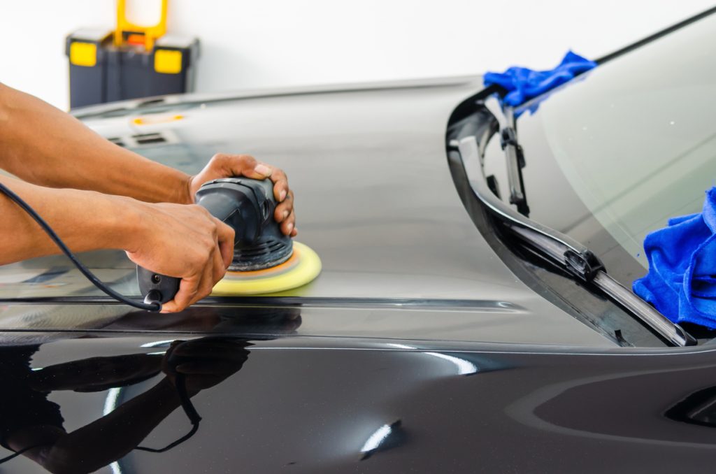 Professional car buffing and polishing Burlington with orbital buffer removing scratches